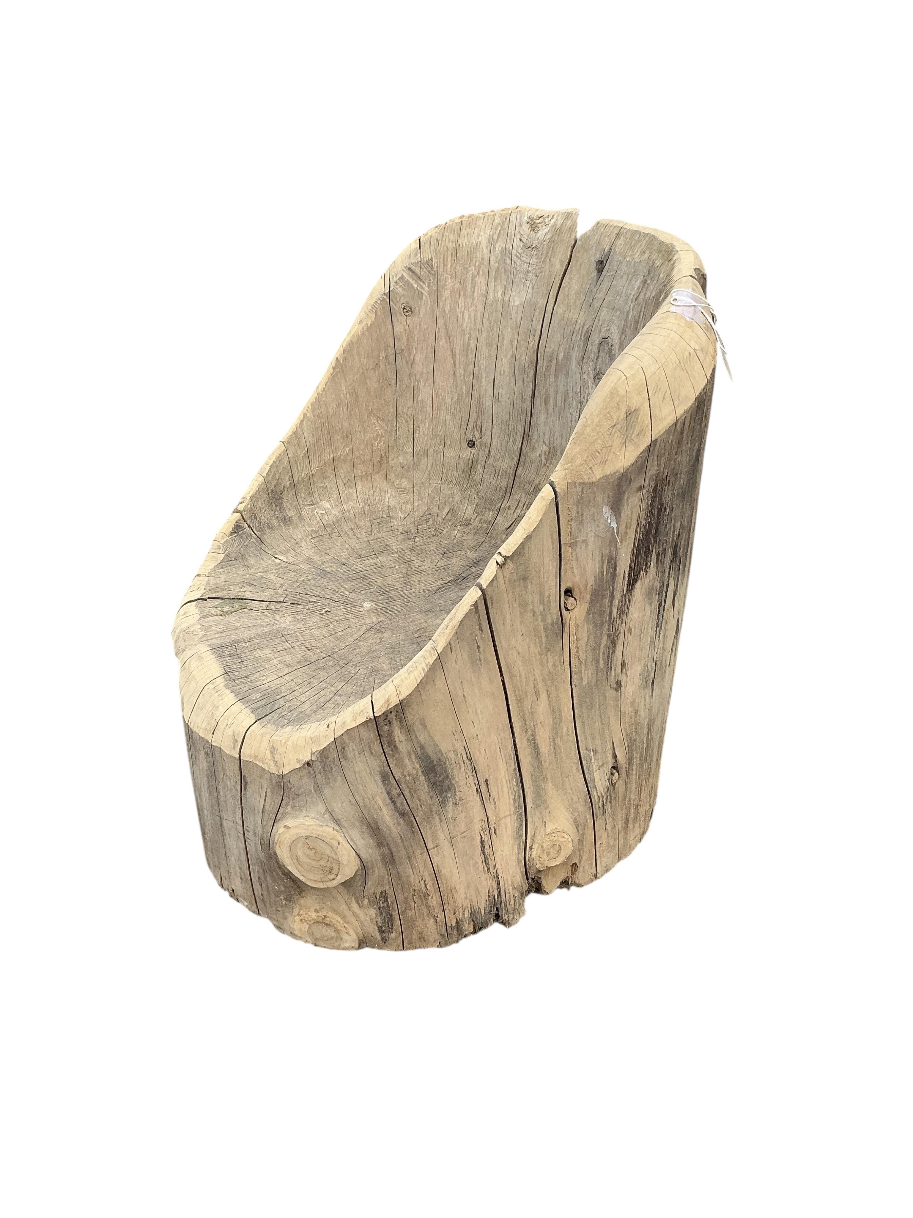 An elm tree section garden seat, width 46cm, height 62cm